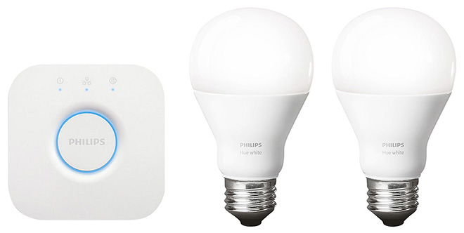 A picture of a Philips Hue set of two light bulbs and hub